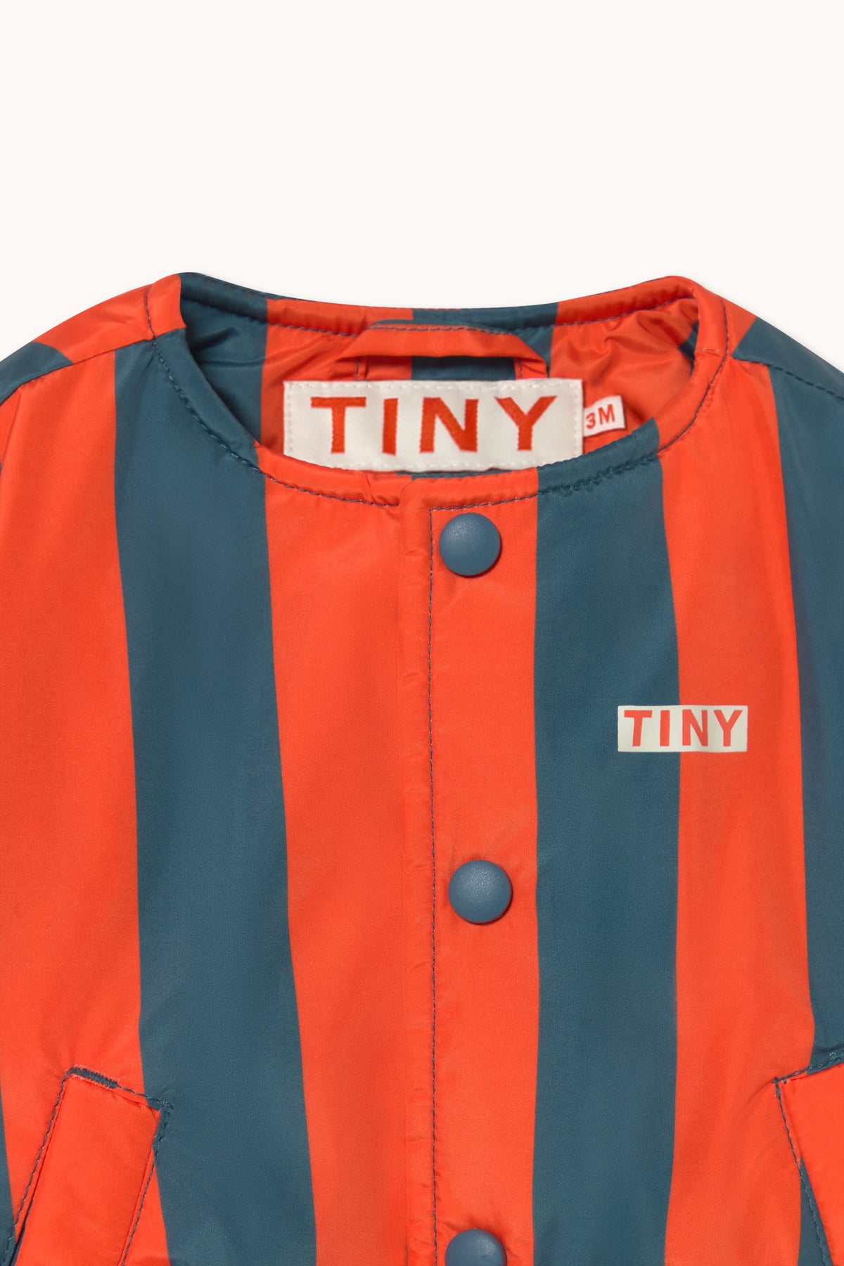 VESTE BÉBÉ MATELASSÉE À RAYURES ROUGES ET BLEUES